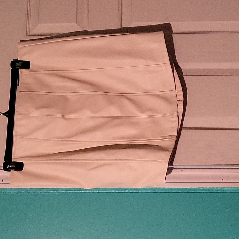 A cream colored pleather skirt
